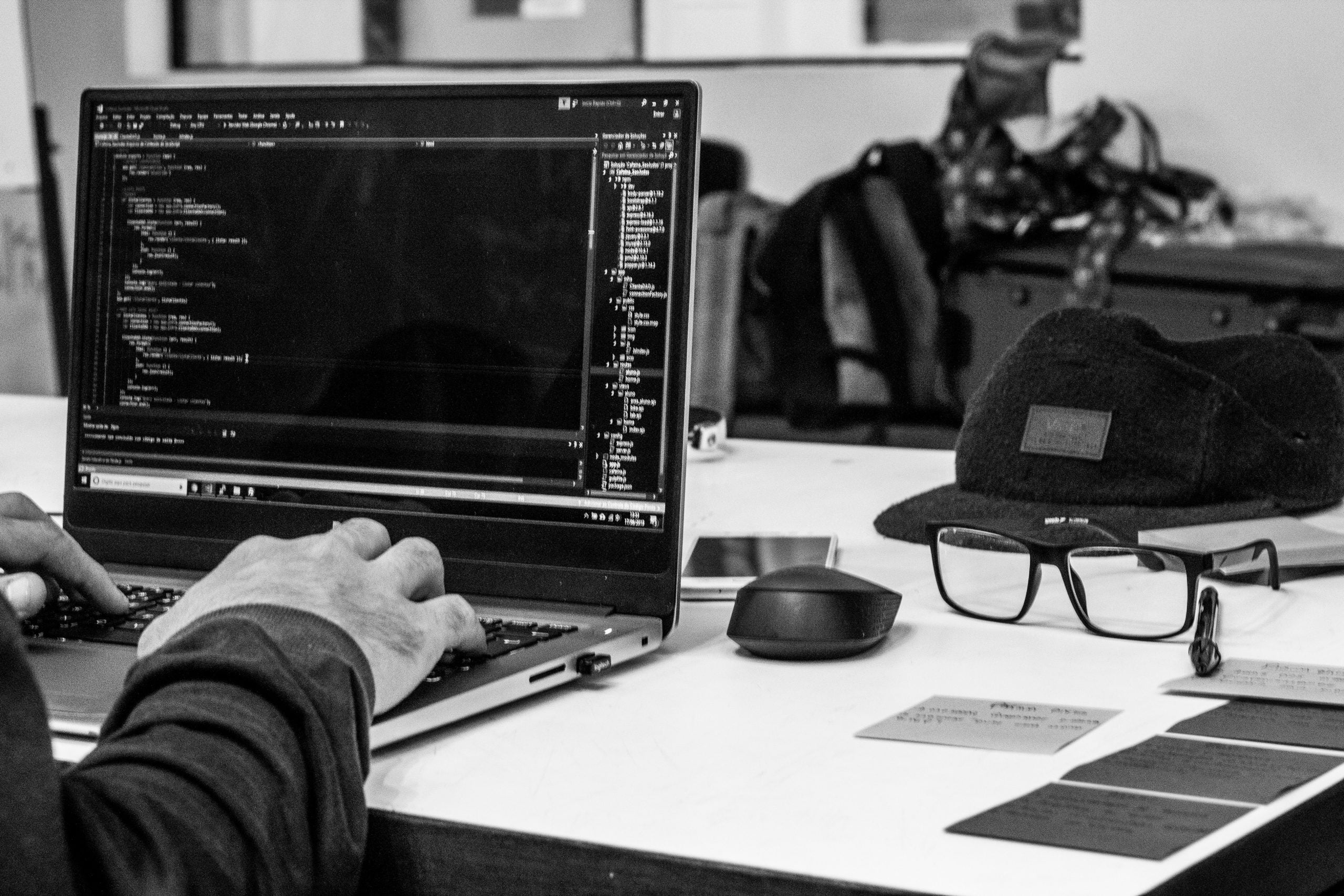 A person coding on their laptop